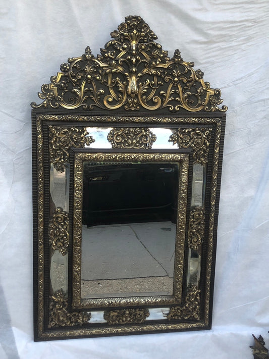 Frencn 19th century repoussé mirror. 128 x 74cm