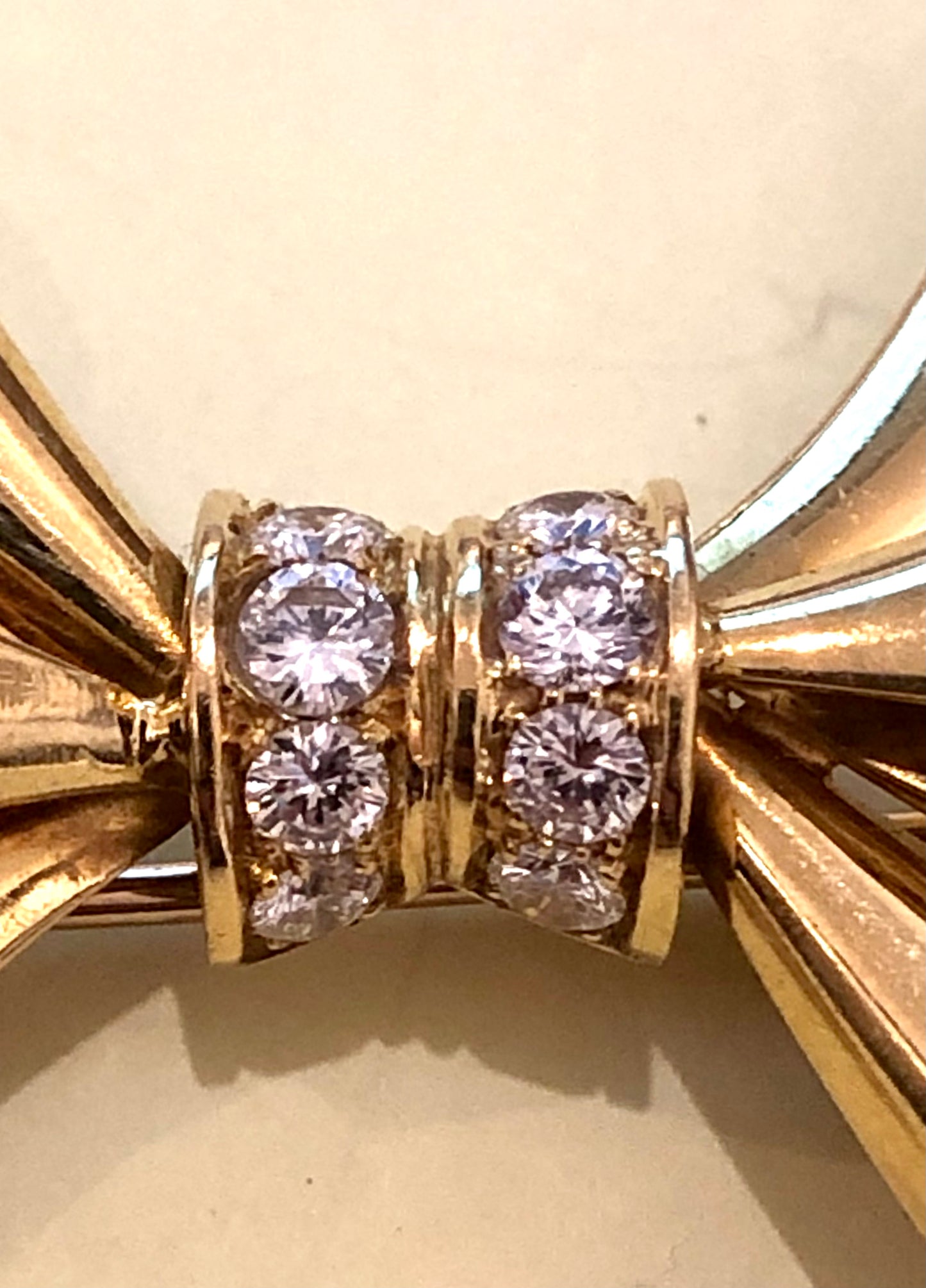 Adler Fine Jewellery. Gold and diamond bow brooch.